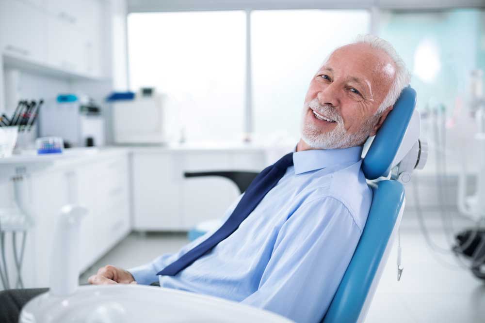 patient smiling after his sedation dentistry