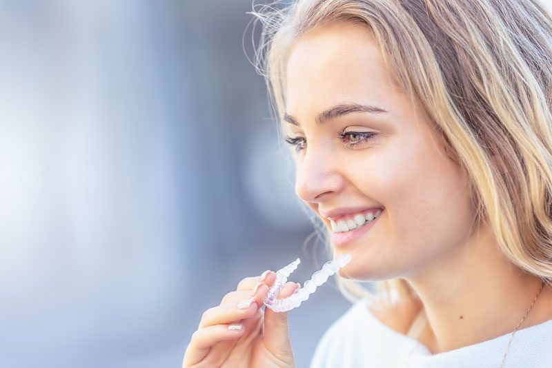 Dental Patient Holding Her ClearCorrect Aligners