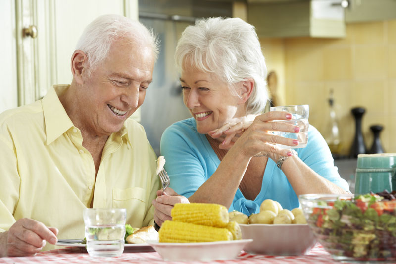 Full Arch Dental Implant Patients Eating Dinner Together
